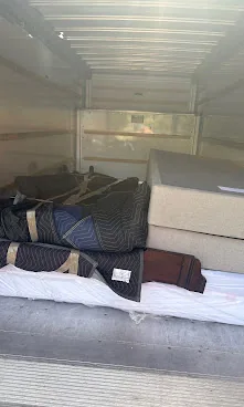 Furniture arranged inside a moving truck